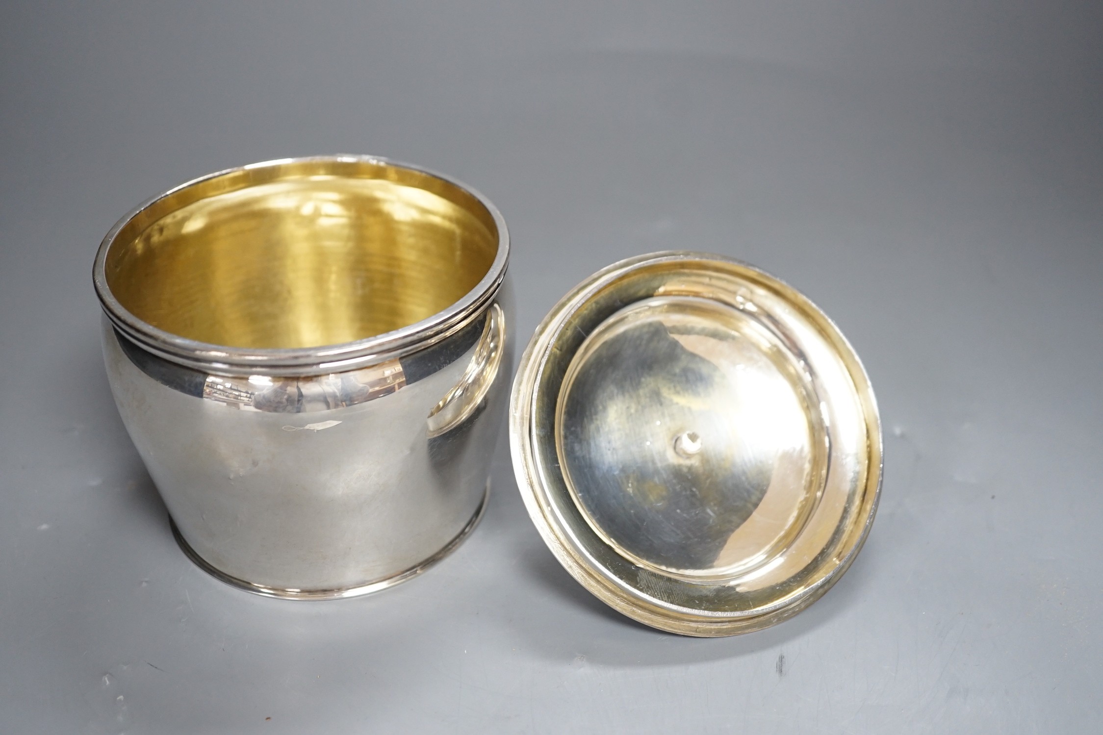 A 20th century continental white metal circular pot and cover, with pseudo marks, height 13cm, gross weight 12 oz.